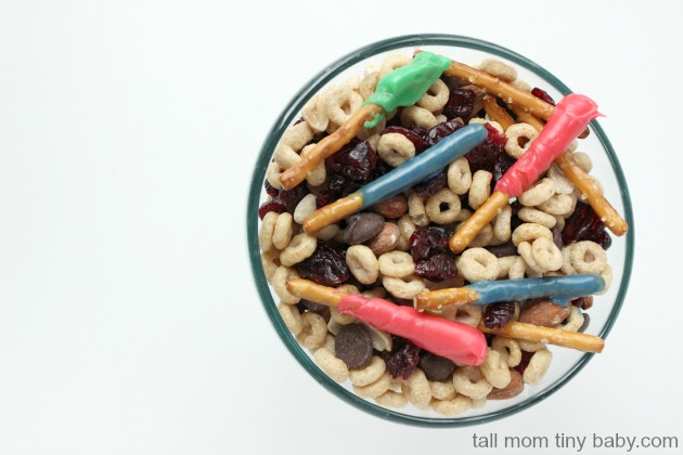 Star Wars fans will love this simple and delicious Dark Side Trail Mix Recipe - easy enough to whip up for a Star Wars movie marathon or to take to the theater to see The Force Awakens. The chocolate covered pretzels act as light sabers and there are dark chocolate chips for "the dark side!" Perfect for a party idea, to serve for your family for a special treat. 